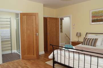 The master bedroom has built-in wardrobes and oak floors (Bedroom 1).