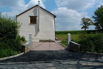The entrance to Moorhayes is gated and the garden is enclosed.