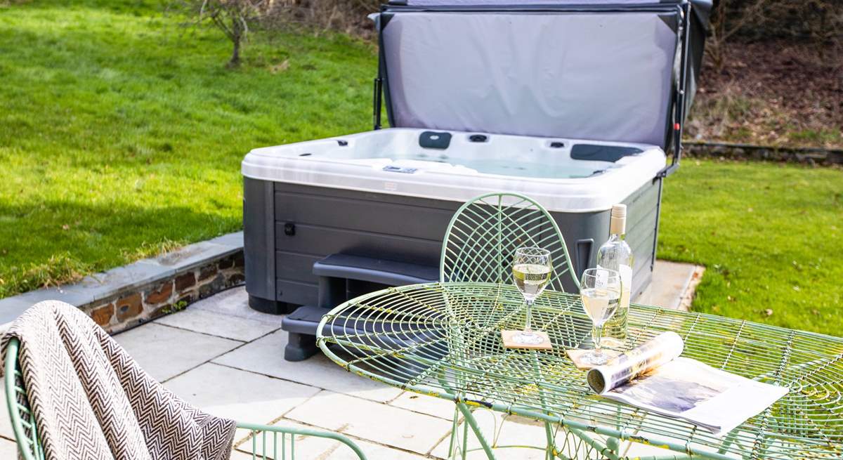 The hot tub on the patio invites you to relax and re-charge.