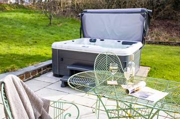 The hot tub on the patio invites you to relax and re-charge.