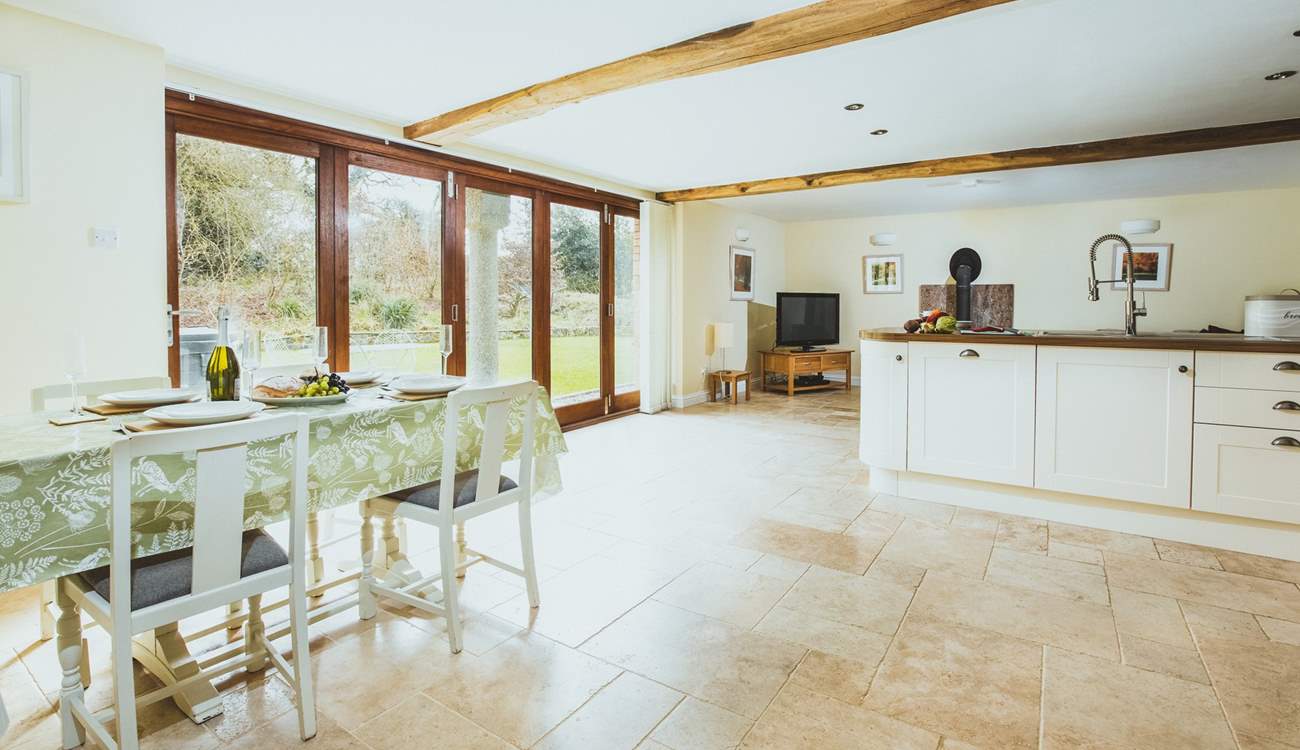 The light and airy kitchen diner has fabulous bi-fold doors.