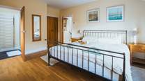 Bedroom 1 has built-in wardrobes and oak floors.
