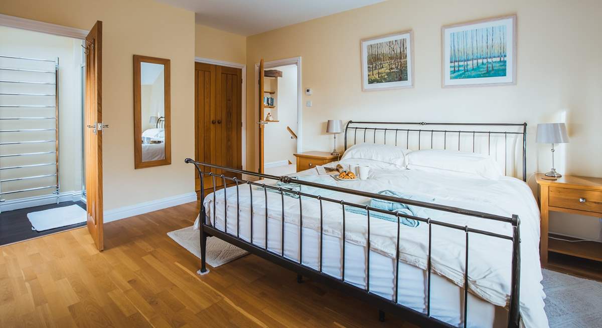 The main bedroom has built-in wardrobes and oak floors (Bedroom 1).