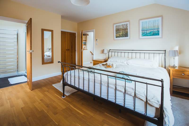 The master bedroom has built-in wardrobes and oak floors (Bedroom 1).