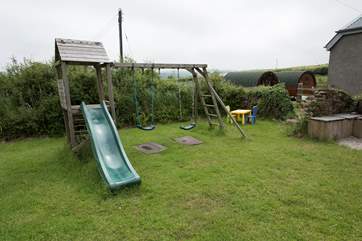 The childrens play area is just beside the pods.