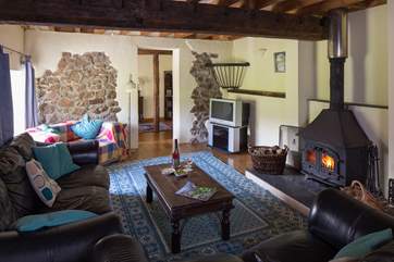 The cosy sitting-room with the dining-room beyond.