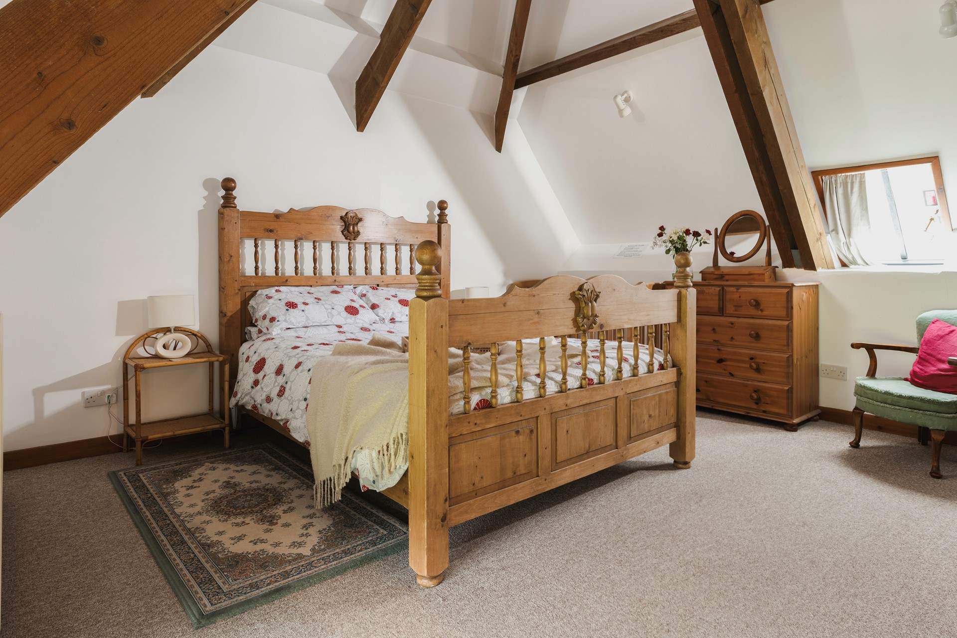 Bedroom 3 has a king-size double bed and a fabulous vaulted ceiling with exposed beams.