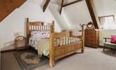 Bedroom 3 has a king-size double bed and a fabulous vaulted ceiling with exposed beams. - Thumbnail Image