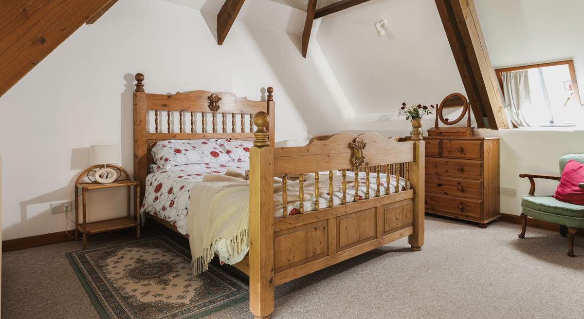 Bedroom 3 has a king-size double bed and a fabulous vaulted ceiling with exposed beams.