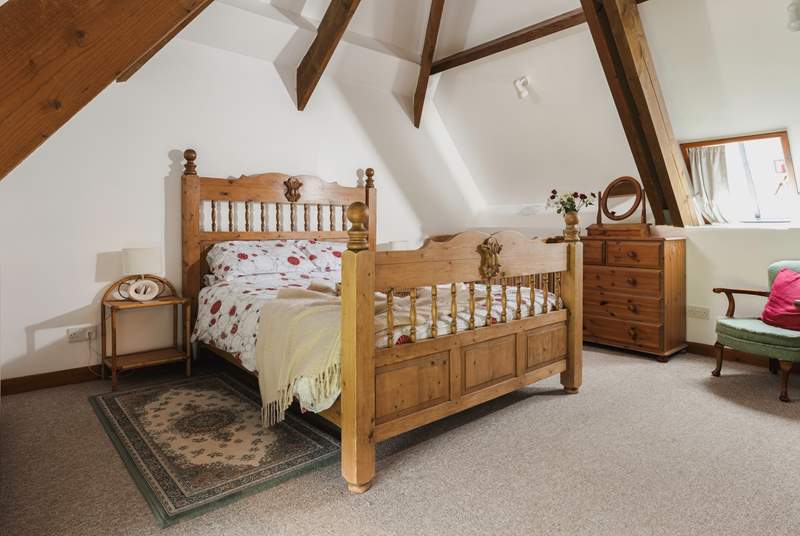 Bedroom 3 has a king-size double bed and a fabulous vaulted ceiling with exposed beams.