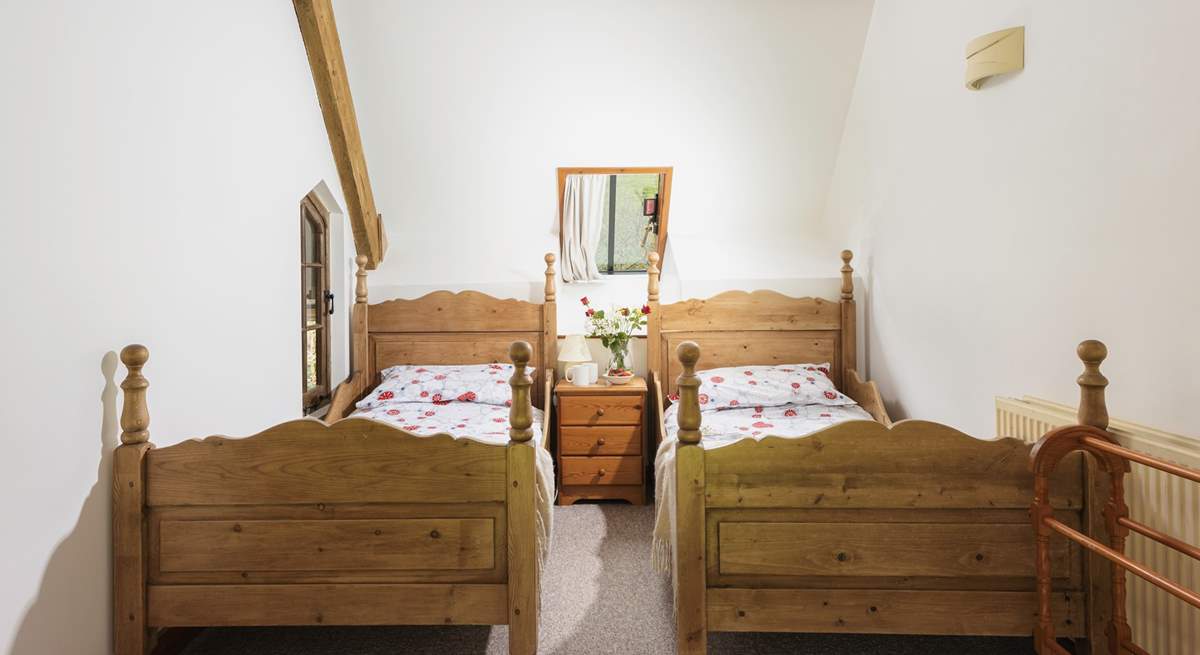 Bedroom 1 is light and airy and has twin beds.