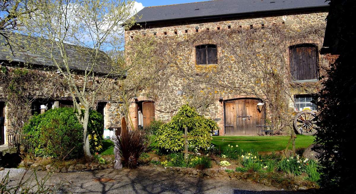 These storage barns are opposite the cottages. The door to the shared laundry-room is on the left of the larger building.