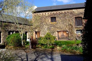 These storage barns are opposite the cottages. The door to the shared laundry-room is on the left of the larger building.