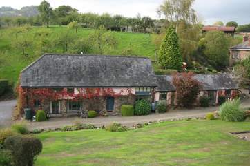The Forge (single storey) is to the right of The Cob with the farmhouse behind - lived in by the owners.