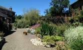 A pretty stream runs down in front of the cottages (take care with toddlers). - Thumbnail Image