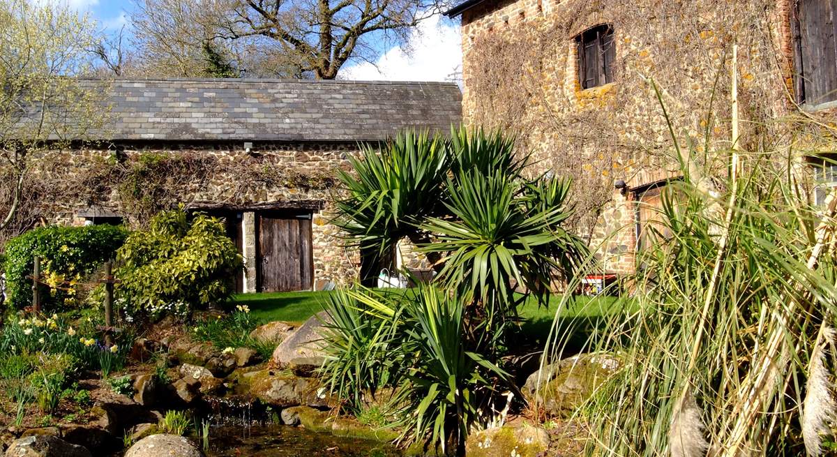 The pretty stream and small pond outside the cottages (take care with children).