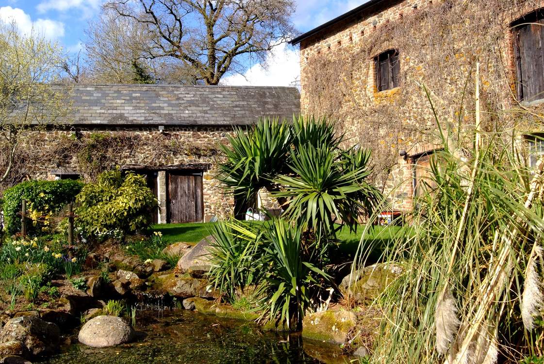 The pretty stream and small pond outside the cottages (take care with children).
