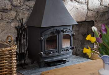 The wood-burner gives a focal point to the sitting-room.