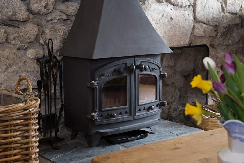 The wood-burner gives a focal point to the sitting-room.