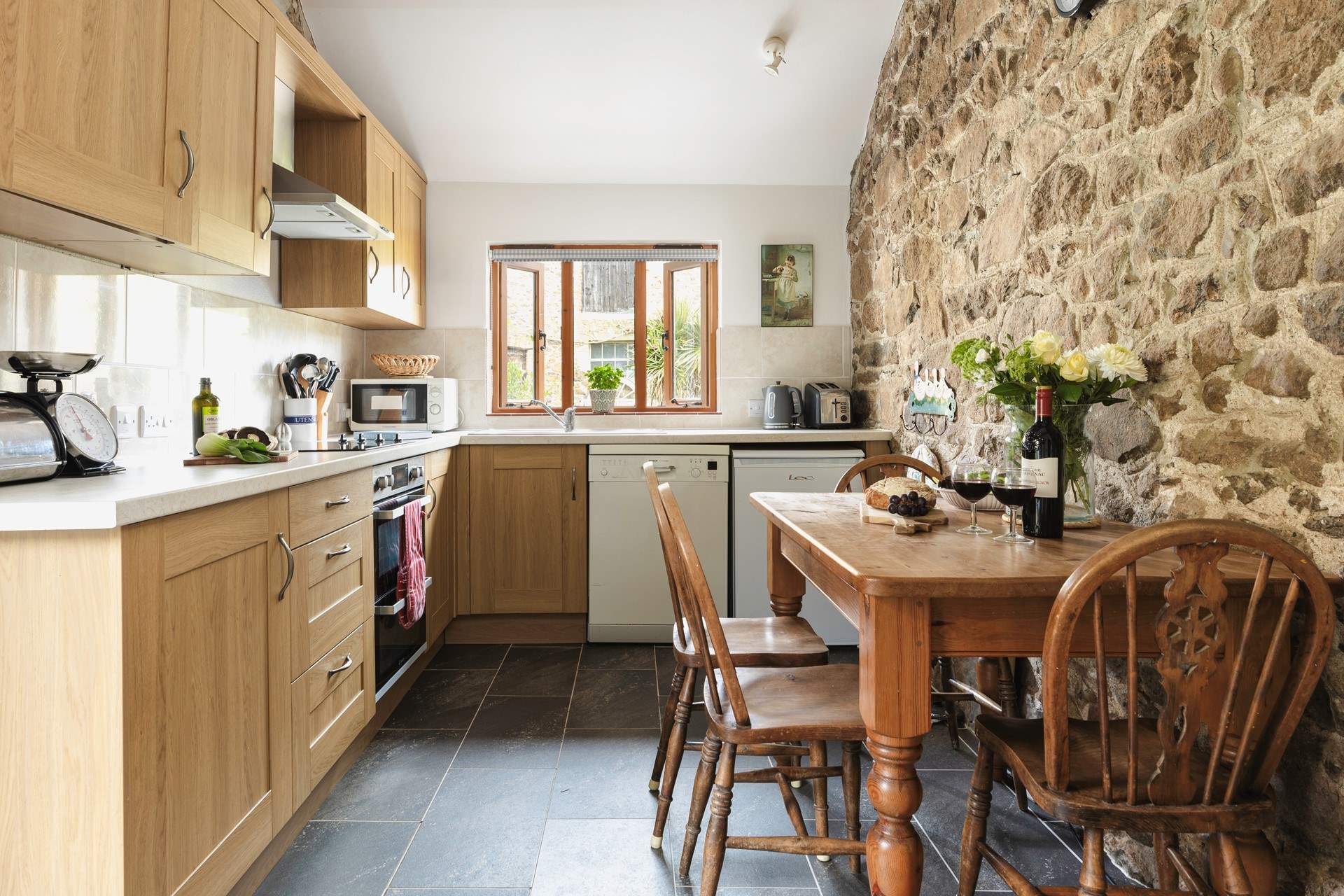 The kitchen/dining-room is the perfect place to come together.
