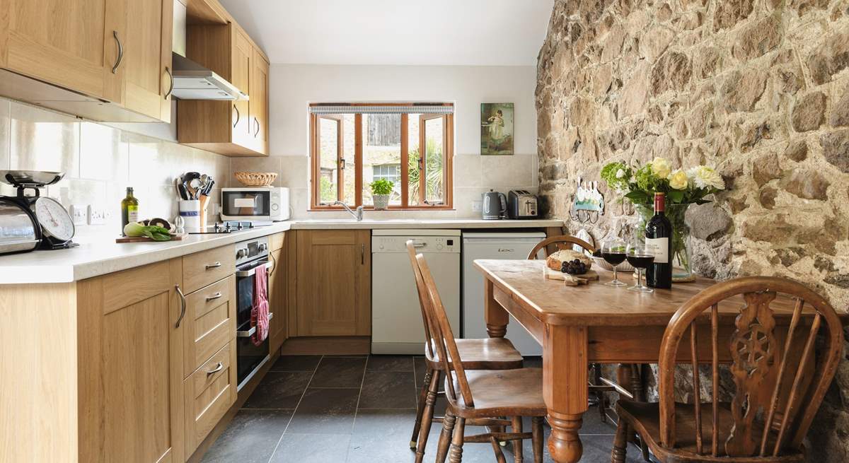 The kitchen/dining-room is the perfect place to come together.