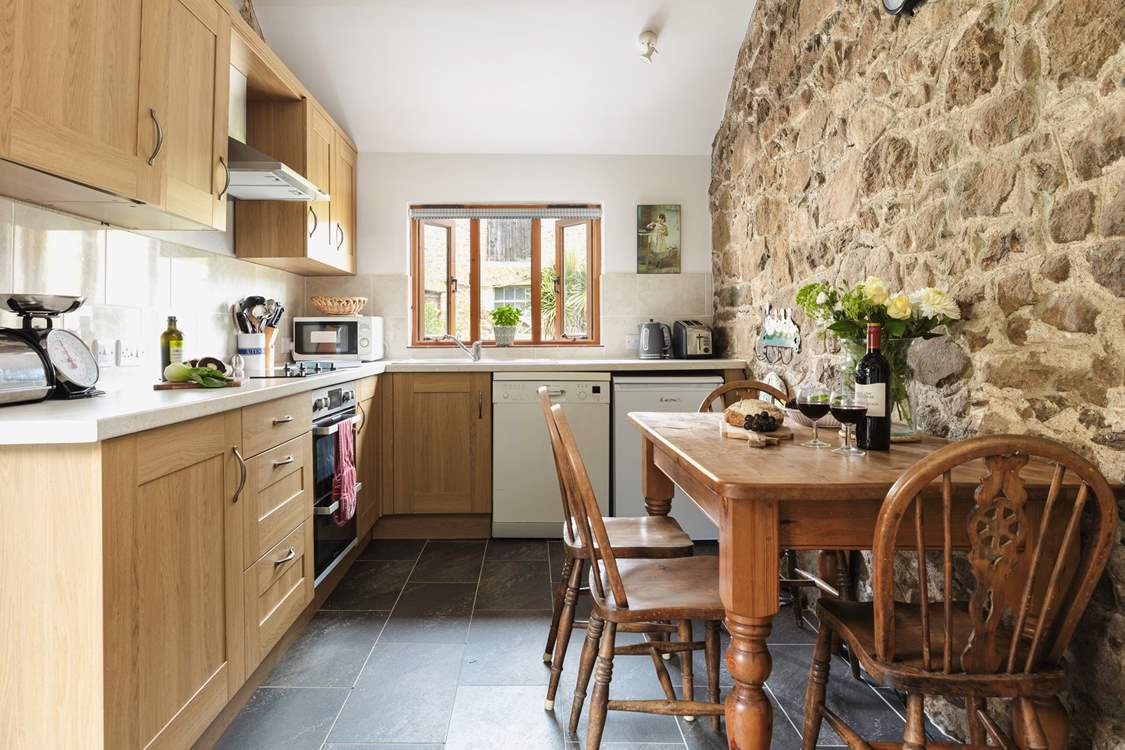 The kitchen/dining-room is the perfect place to come together.