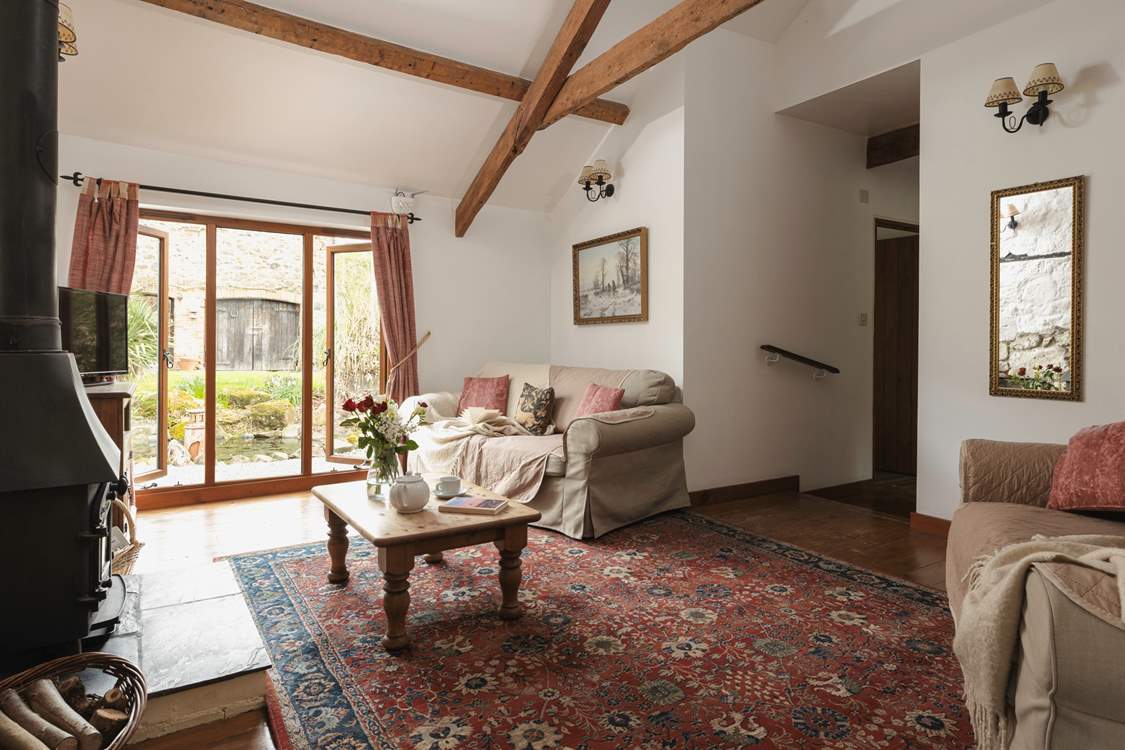 The sitting-room window looks out to the stream.