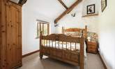 Bedroom 1 is a cosy double with original exposed beams. - Thumbnail Image