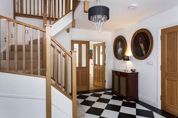 The hall-way has a fabulous staircase leadiing up to the first floor.