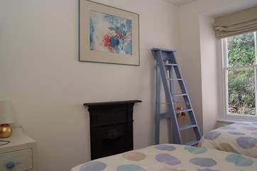 The twin bedroom with its innovative step ladder storage-area.