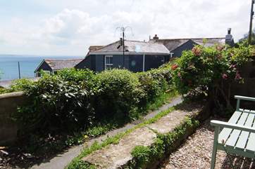 The cottage is set on a pedestrian lane.