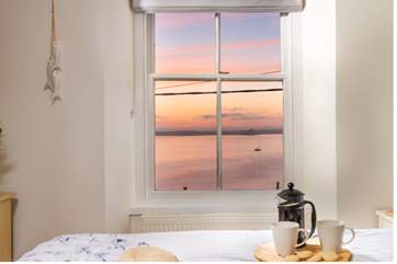 Sit back and enjoy the sunset from the comfort of your own bed.