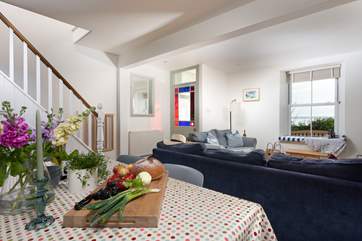 The homely open plan living space greets you as you enter.