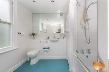 The large bathroom is the perfect place to unwind after a day on the beach.