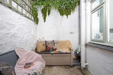 A charming courtyard sits at the rear of the house.