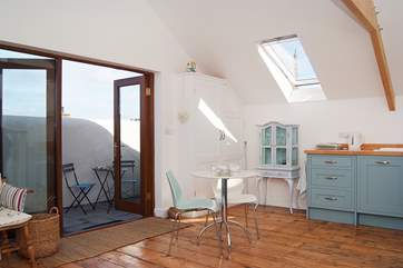 Doors lead out to the sunny terrace.