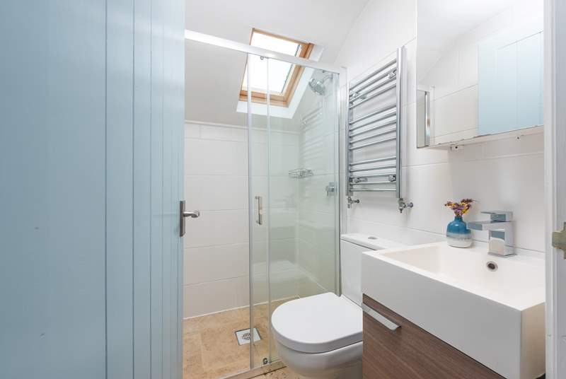 The shower room has a large walk-in shower, perfect to wash salty toes after a day on the beach.