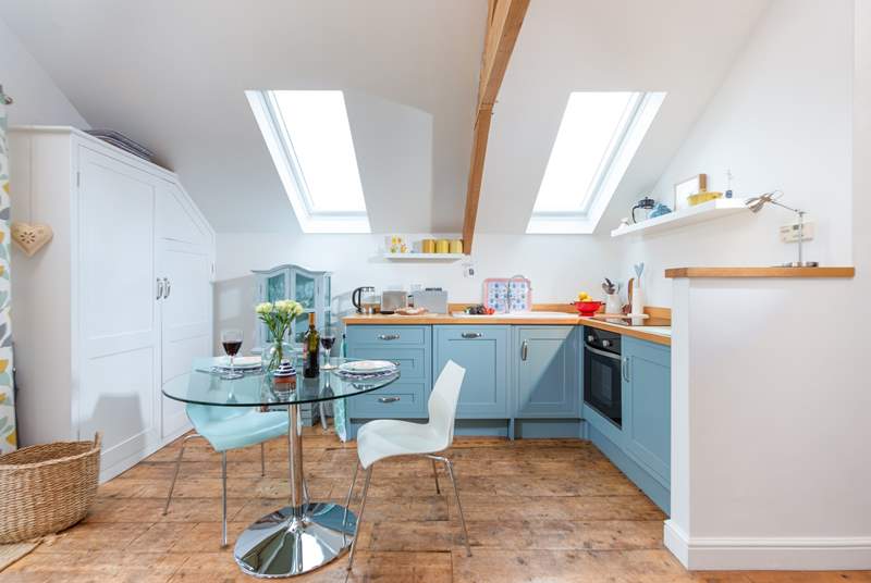 The kitchen-dining area is light and bright thanks to the Velux windows.