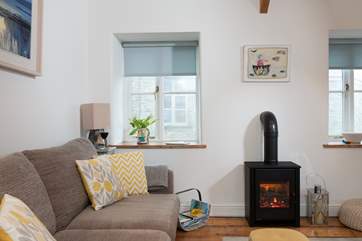 The coal-effect electric fire will keep you cosy throughout the seasons.