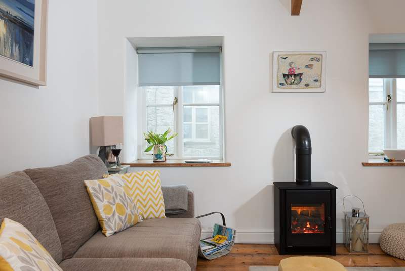 The coal-effect electric fire will keep you cosy throughout the seasons.