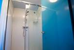 The en suite shower-room with walk-in double shower.