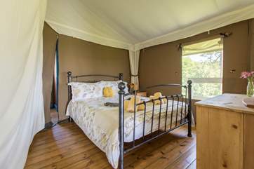 The pretty double bedroom is at the back of the tent.