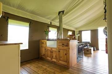 The kitchen includes a sink with hot and cold running water.