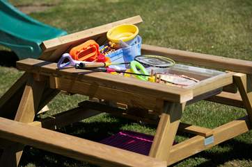 There is a sweet sandpit provided outside too.