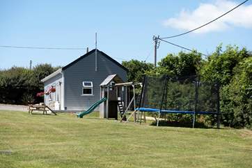Situated in the parking-area, behind the tents, the fabulous 'shed' includes an honesty-shop, small games-room and cinema room!