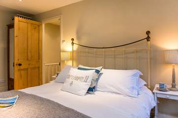 Bedroom 1 has a beautiful bedstead.