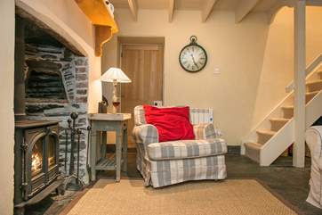 The stairs lead off from the sitting-area up to the bedrooms.