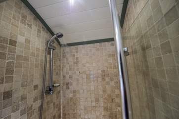 The en suite shower-room with shower and proper flushing toilet.