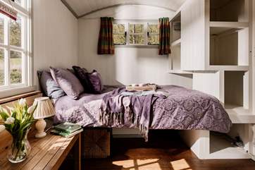 The cosy double bed offers a peaceful night's sleep.