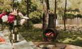 As dusk falls, light the chiminea and stay cosy.  - Thumbnail Image